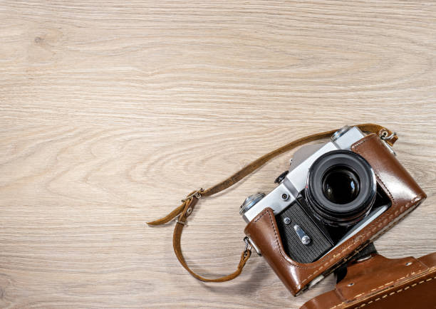 istock Old film camera in a brown leather case photographed on 638343780