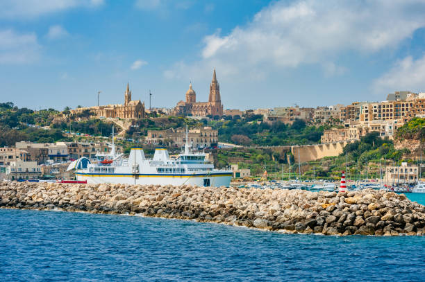 Harbour of Mgarr Gozo Harbour and skyline of Mgarr, Gozo. Ferries to and from Malta arrive and depart here. mgarr malta island gozo cityscape with harbor stock pictures, royalty-free photos & images