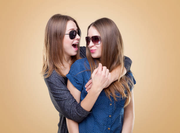 istock Studio portait of young twin sisters embracing 638349870
