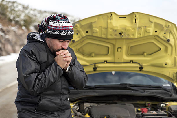 istock helpless man beside his car 638350456
