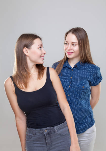 istock Studio portait of young twin sisters 638351400
