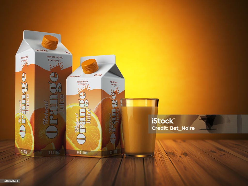 Carton de jus d’orange carton paquet avec verre sur orange - Photo de Jus en brique libre de droits