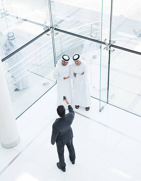 istock Three arab business men taking a picture 638351626