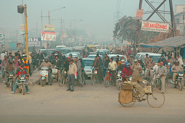 A bicycle is standing near a tree in an empty market and a market bag is hanging