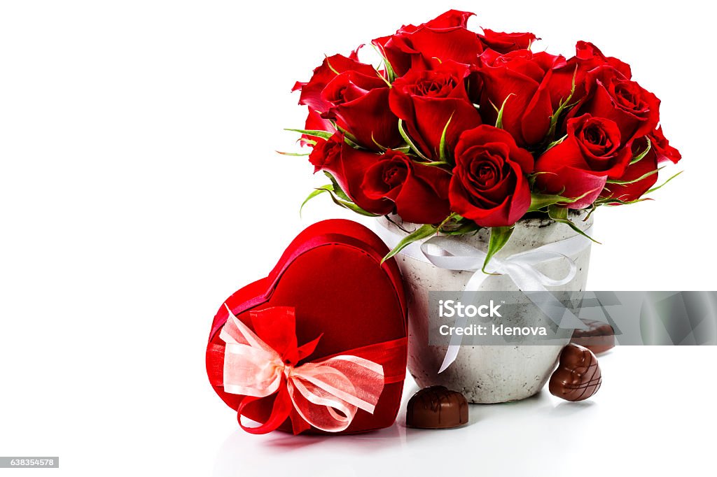 Valentine composition Valentine composition with roses and gift box over white Arrangement Stock Photo