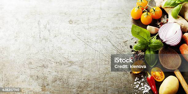 Wooden Spoon And Fresh Organic Vegetables On Old Background Stock Photo - Download Image Now