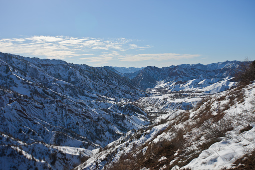 Mountain landscape in the valley of Sarikhosor after the winter snowfall. Tajikistan,