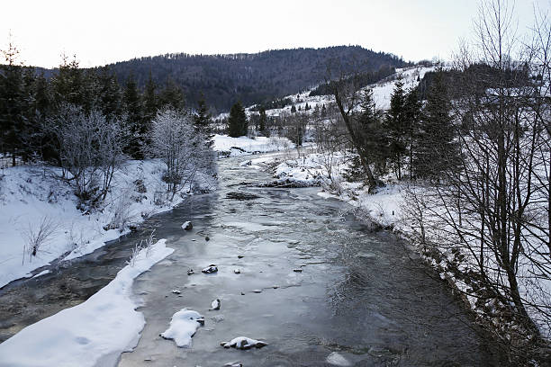 istock winter landscape with frozen river 638358384