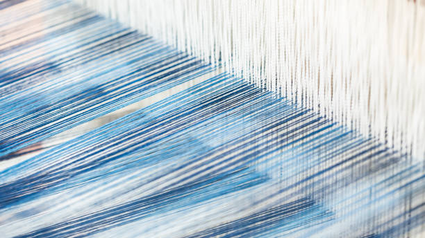 Closeup, abstract motion blur of silk fabric weaving stock photo