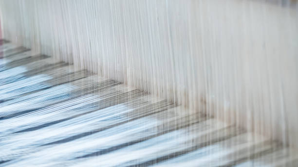 istock Closeup, abstract motion blur of silk fabric weaving 638359970