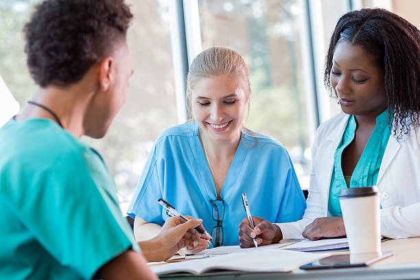 istock Group of medical students study together for exam 638361124