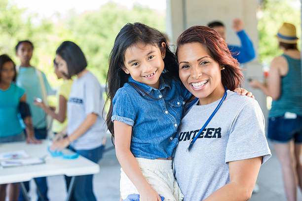 istock Happy volunteer physician with young patient 638362268