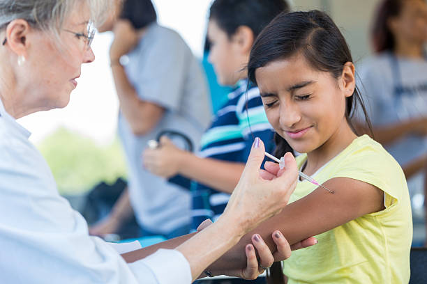 istock Preteen girl grimaces while receiving injection 638362294