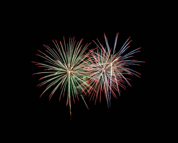 Fireworks of various colors isolated on black background stock photo