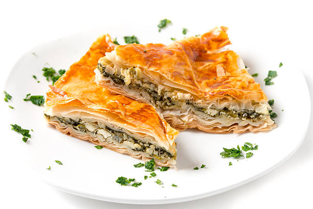 Spanakopita (greek spinach pie) Spanakopita is a Greek pastry filled with spinach and cheese spanakopita stock pictures, royalty-free photos & images