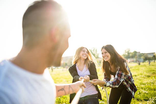 istock Friends doing the Tug of war - teamwork 638363456