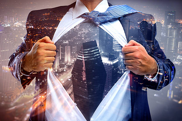 istock Superhero businessman double exposure with cityscape 638363844