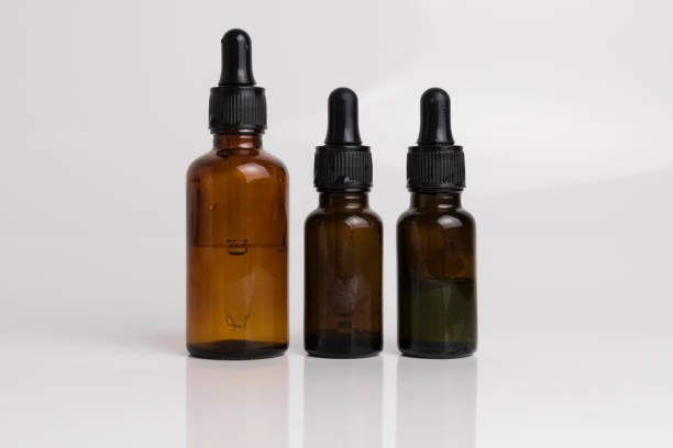 istock isolated drop glass bottle in brown color. 638364648
