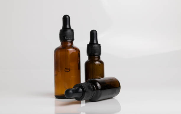 istock isolated drop glass bottle in brown color. 638364670