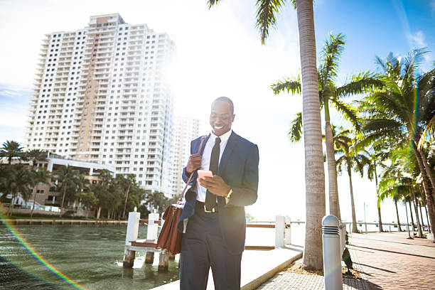 istock businessman texting in miami 638365428
