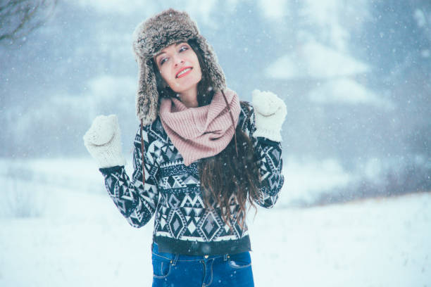 istock young woman enjoying in the snow 638370274
