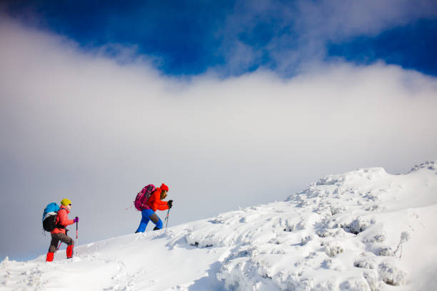 istock Climbers are on snow slope. 638374748