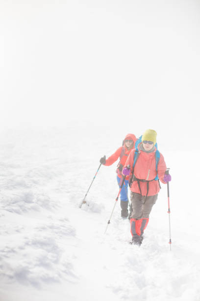 istock Climbing a mountain during bad weather. 638376732
