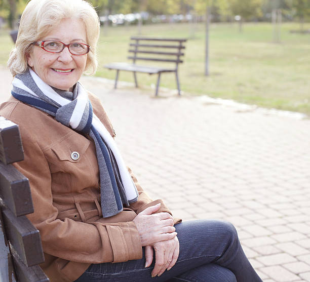 istock Cheerful woman at park 638378236