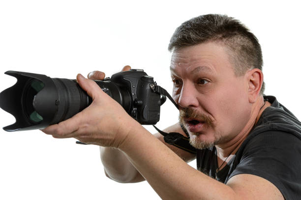 istock portrait photographer with a camera on an isolated background 638378950