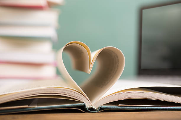 istock Heart shape in open school book pages. 638379224