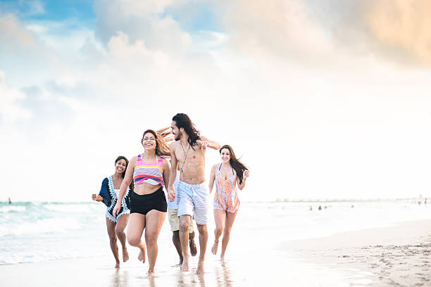 istock Group of friends running on the beach 638379968