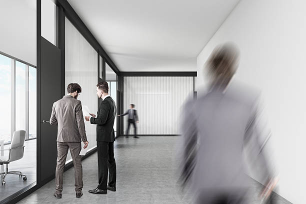 istock People walking in an office corridor 638381326