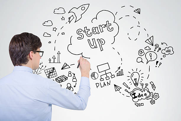istock Businessman in blue shirt is drawing project sketch 638381438