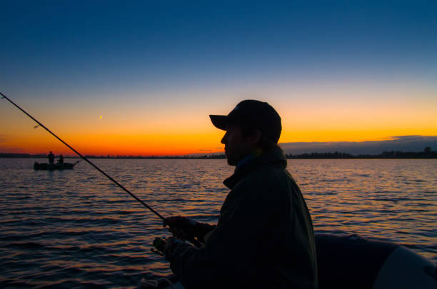 istock Silhouette of fisherman 638381546