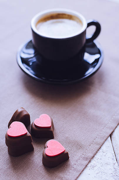 istock Cup of coffee with chocolate sweets 638383028