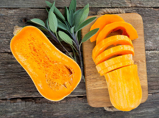 istock butternut squash on wooden background 638383434