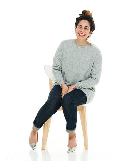cheerful sitting on chair - puerto rican ethnicity women smiling cheerful imagens e fotografias de stock