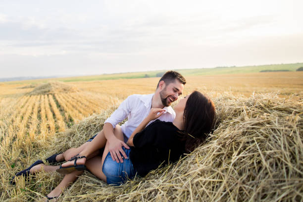 istock couple having fun in a field 638383726