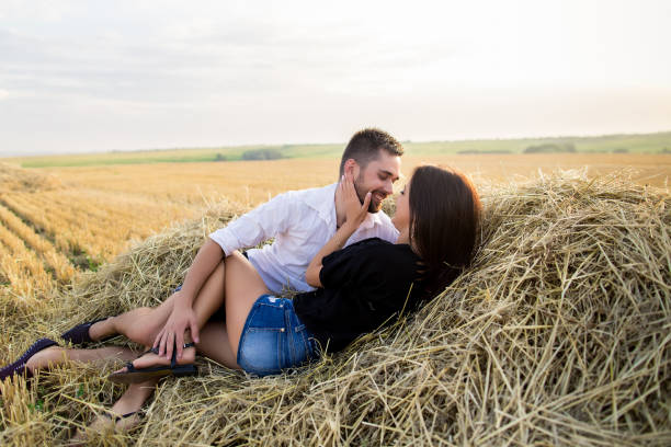 istock couple having fun in a field 638383764