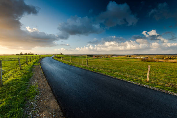 istock Empty raod in farm fields in Normandy,France 638384062