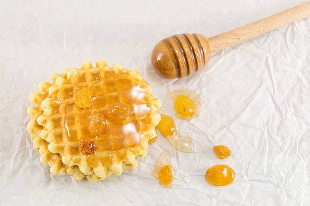 istock Waffle cookies and sweet honey 638384558