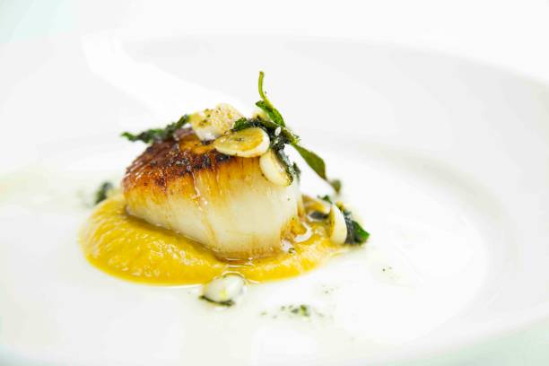 istock Seared Scallop with Garlic Sage Sauce and Pureed Pumkin 638385884