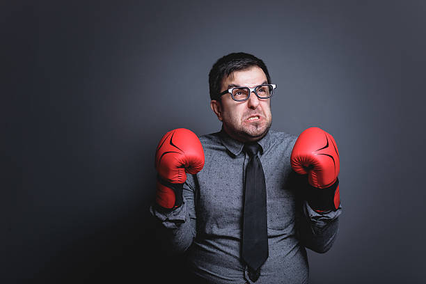istock Power of funny businessman on blackboard 638386740