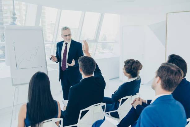 istock Successful aged businessman explaining the graph on the whiteboard 638387050