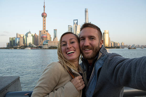 istock Young couple taking selfie in Shanghai 638387584