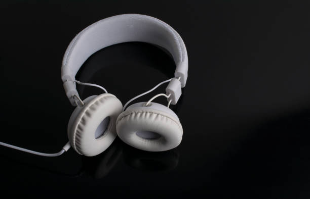 istock Isolated white headphone on a black background 638391508
