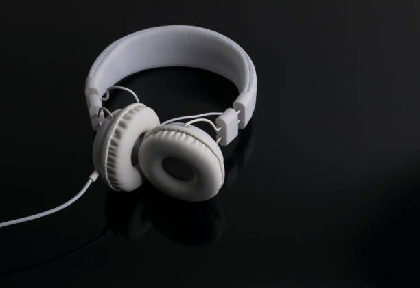 istock Isolated white headphone on a black background 638391544