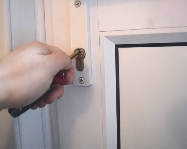 istock opening door with key in lock 638392400