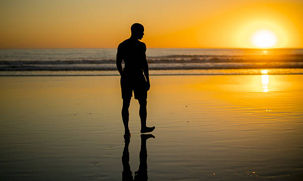 istock Young black athlete practicing on the beach at sunset 638393774