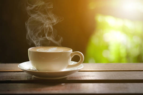 istock Hot coffee on a wooden table on the terrace. 638394070